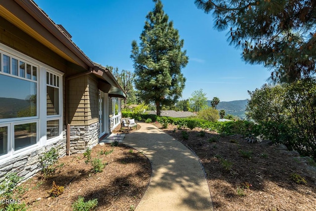 view of yard with a mountain view and a patio area