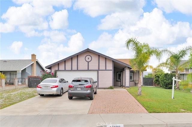 14696 Blackbush Rd, Moreno Valley, CA 92553 - single story home featuring a garage, driveway, a front lawn, and fence