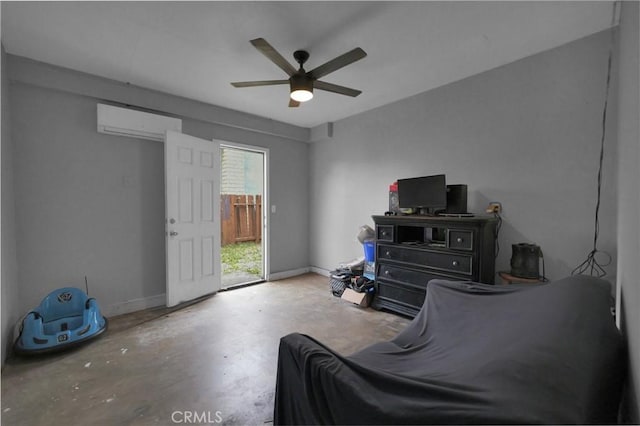 14696 Blackbush Rd, Moreno Valley, CA 92553 - sitting room with ceiling fan, concrete floors, baseboards, and a wall unit AC
