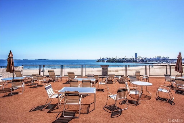 exterior space featuring a water view and a view of the beach