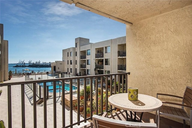 balcony featuring a water view