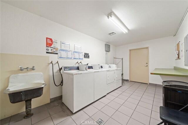 1140 E Ocean Blvd Unit 220, Long Beach, CA 90802 - community laundry room with washing machine and clothes dryer and light tile patterned floors