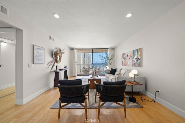 1140 E Ocean Blvd Unit 220, Long Beach, CA 90802 - dining area with wood finished floors, baseboards, expansive windows, and recessed lighting