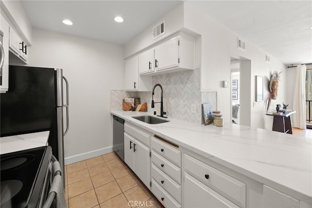 1140 E Ocean Blvd Unit 220, Long Beach, CA 90802 - kitchen with a sink, appliances with stainless steel finishes, tasteful backsplash, white cabinets, and light tile patterned floors