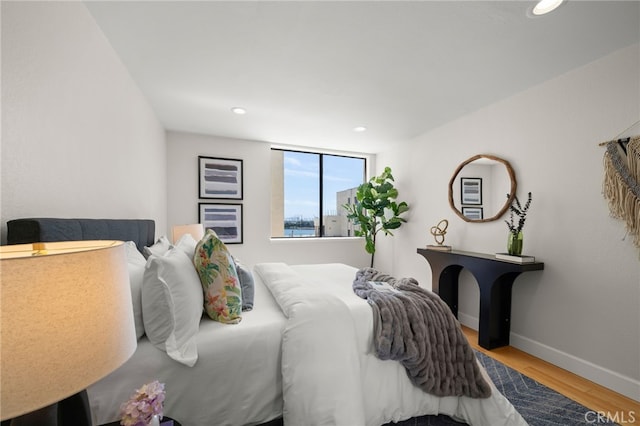 1140 E Ocean Blvd Unit 220, Long Beach, CA 90802 - bedroom featuring wood finished floors, recessed lighting, and baseboards
