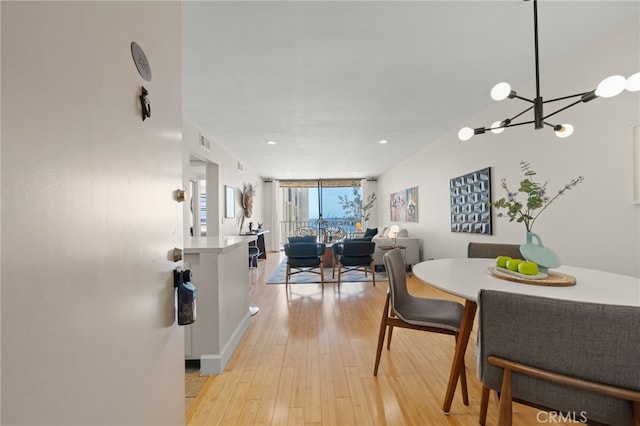 1140 E Ocean Blvd Unit 220, Long Beach, CA 90802 - dining area featuring light wood finished floors, a chandelier, and recessed lighting