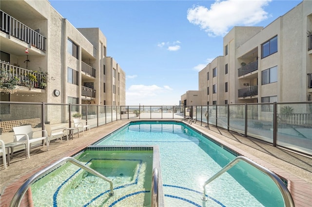 1140 E Ocean Blvd Unit 220, Long Beach, CA 90802 - view of pool with fence and a pool with connected hot tub