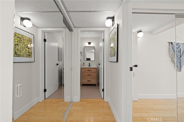 1140 E Ocean Blvd Unit 220, Long Beach, CA 90802 - corridor with light wood finished floors and baseboards