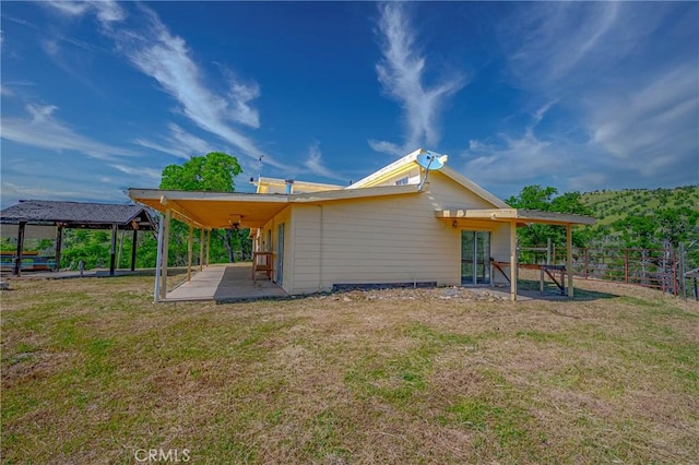 exterior space featuring a yard, a gazebo, fence, and a patio