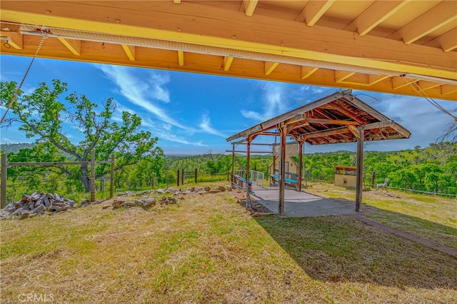 view of yard featuring a patio and fence