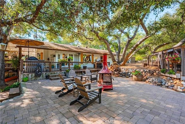 view of patio / terrace with an outdoor fire pit