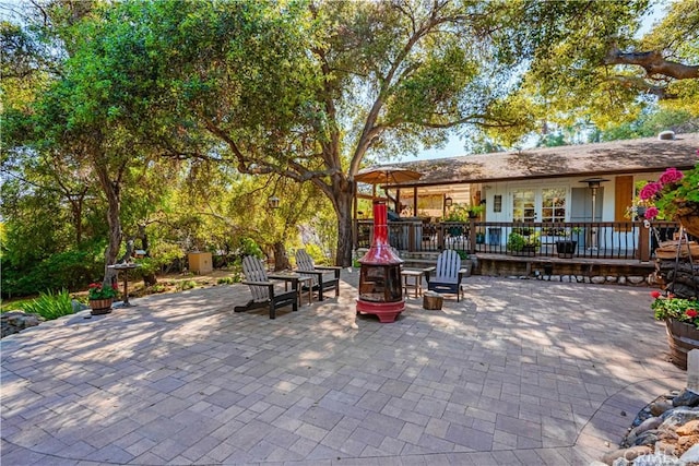 view of patio / terrace featuring an outdoor fire pit