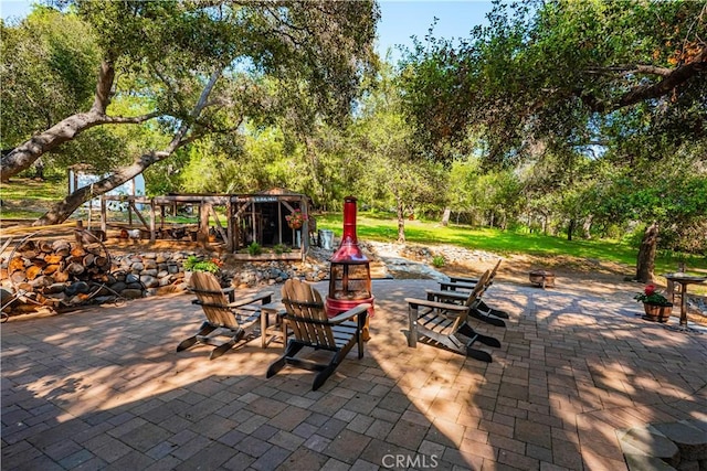 view of patio featuring a fire pit