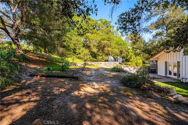 view of yard featuring french doors