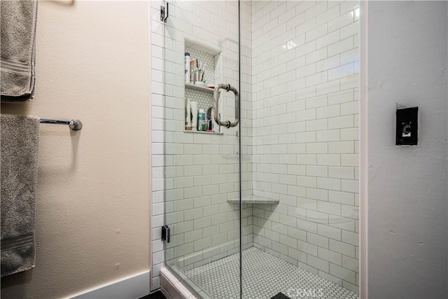 bathroom featuring a shower stall