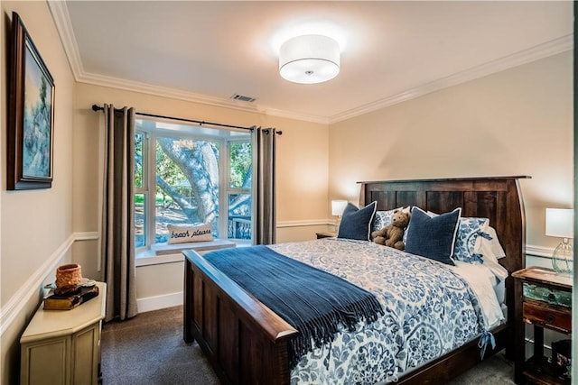 bedroom featuring ornamental molding, dark carpet, and visible vents