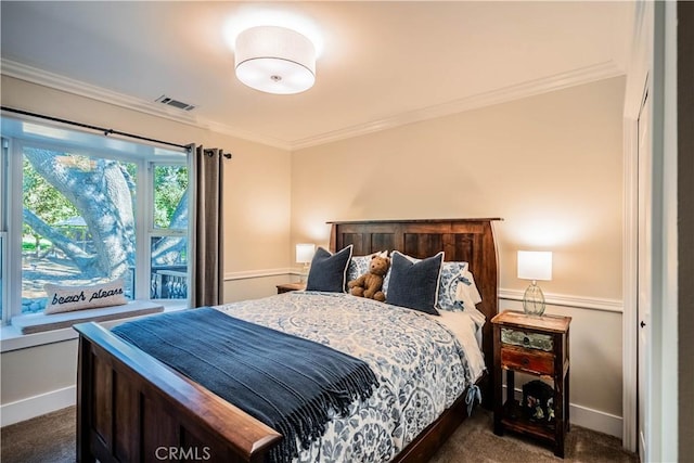 bedroom featuring baseboards, crown molding, dark colored carpet, and visible vents