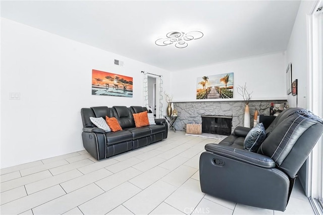 5201 Del Serra Cir, La Palma, CA 90623 - living area featuring light tile patterned floors and a stone fireplace