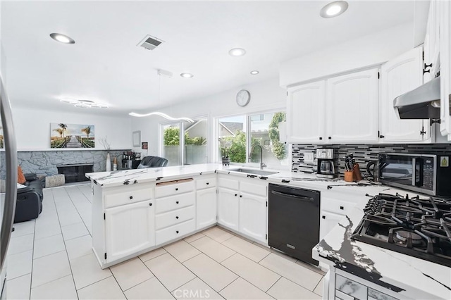 5201 Del Serra Cir, La Palma, CA 90623 - kitchen with black appliances, a sink, under cabinet range hood, a peninsula, and white cabinets