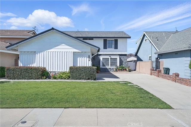 5201 Del Serra Cir, La Palma, CA 90623 - view of front facade with concrete driveway and stone siding