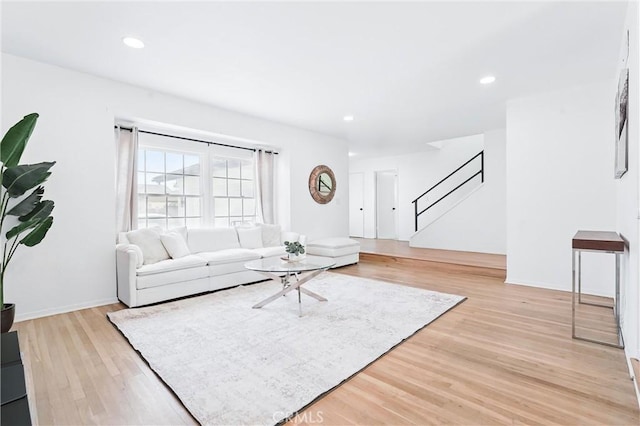 5201 Del Serra Cir, La Palma, CA 90623 - living room with stairs, light wood-style floors, recessed lighting, and baseboards
