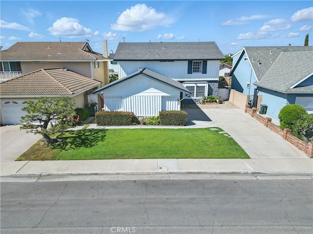 5201 Del Serra Cir, La Palma, CA 90623 - traditional-style house with concrete driveway, a front yard, and a residential view