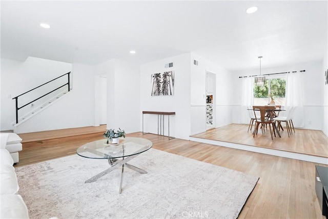 5201 Del Serra Cir, La Palma, CA 90623 - living area featuring light wood finished floors, stairs, and recessed lighting