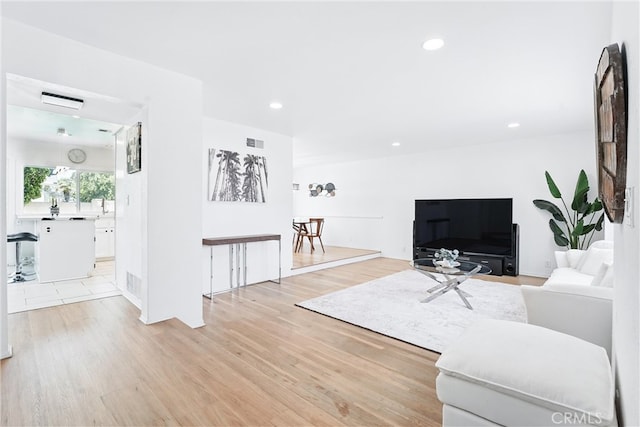 5201 Del Serra Cir, La Palma, CA 90623 - living area with light wood-type flooring and recessed lighting