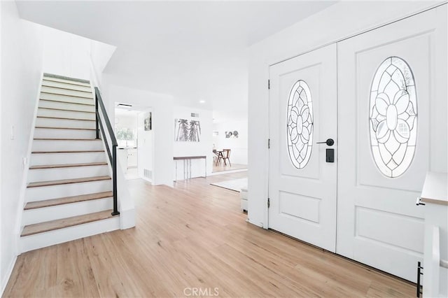 5201 Del Serra Cir, La Palma, CA 90623 - entrance foyer with light wood-style floors and stairs