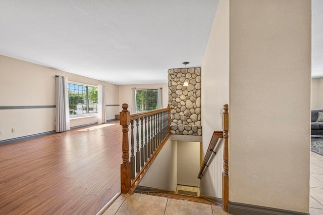 staircase featuring wood finished floors
