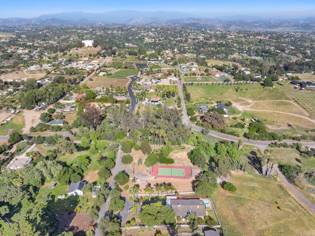 birds eye view of property with a mountain view