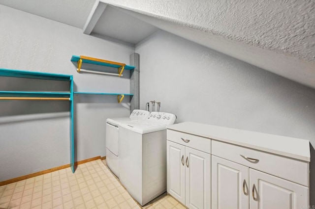 laundry area with washer and dryer, cabinet space, a textured ceiling, baseboards, and light floors