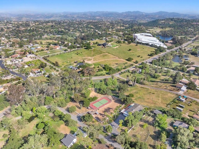 bird's eye view with a water and mountain view