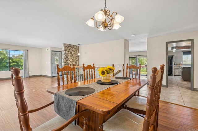 3223 Olive Hill Rd, Fallbrook, CA 92028 - dining space featuring a notable chandelier and wood finished floors