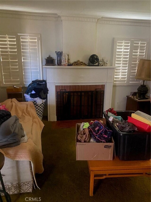 8802 S Wilton Pl, Los Angeles, CA 90047 - living room featuring crown molding and a fireplace