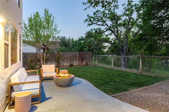view of yard featuring an outdoor living space, a patio area, and a fenced backyard
