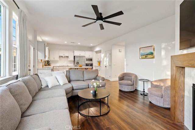 living area with ceiling fan, baseboards, dark wood-style floors, and recessed lighting