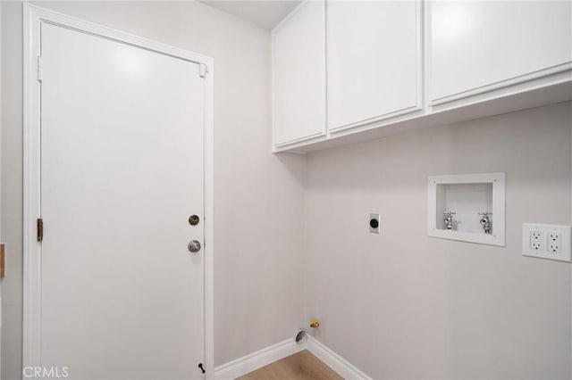4930 Rockhampton Ct, Yorba Linda, CA 92887 - laundry area with cabinet space, wood finished floors, hookup for an electric dryer, baseboards, and hookup for a washing machine