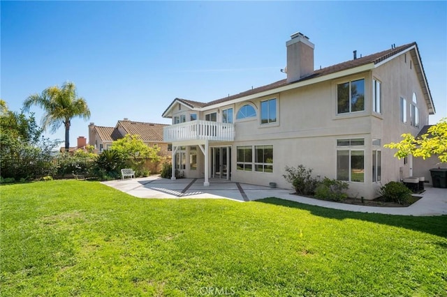 4930 Rockhampton Ct, Yorba Linda, CA 92887 - rear view of property with a balcony, a chimney, a yard, a patio area, and stucco siding
