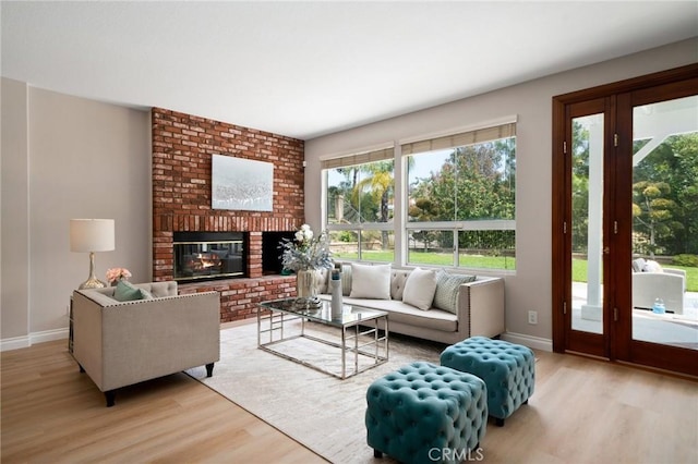 4930 Rockhampton Ct, Yorba Linda, CA 92887 - living room with plenty of natural light, wood finished floors, baseboards, and a brick fireplace