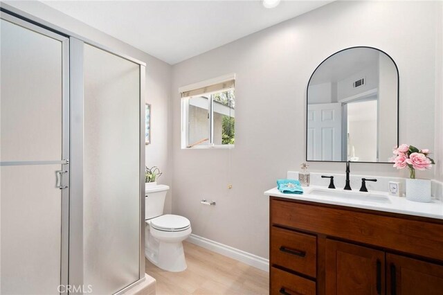 4930 Rockhampton Ct, Yorba Linda, CA 92887 - bathroom with toilet, a stall shower, visible vents, baseboards, and vanity