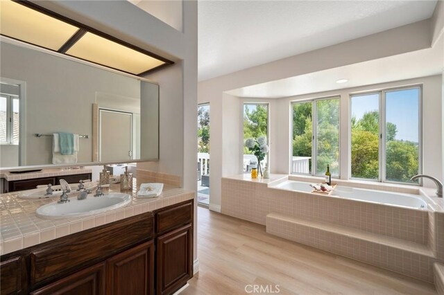 4930 Rockhampton Ct, Yorba Linda, CA 92887 - full bathroom with vanity, a bath, and wood finished floors