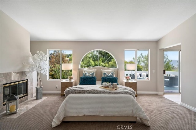 4930 Rockhampton Ct, Yorba Linda, CA 92887 - carpeted bedroom featuring a premium fireplace, baseboards, multiple windows, and access to exterior