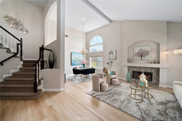 4930 Rockhampton Ct, Yorba Linda, CA 92887 - living area featuring an inviting chandelier, wood finished floors, stairway, baseboards, and a high end fireplace