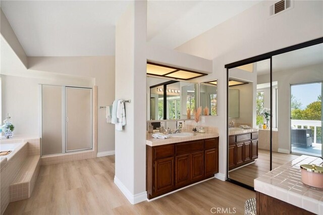 4930 Rockhampton Ct, Yorba Linda, CA 92887 - bathroom featuring a garden tub, vanity, visible vents, and wood finished floors
