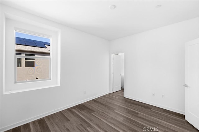 225 Scratch Rd, Covina, CA 91722 - empty room featuring dark wood-type flooring and baseboards