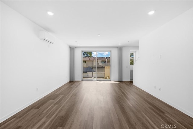 225 Scratch Rd, Covina, CA 91722 - unfurnished living room with wood finished floors, a wall mounted AC, baseboards, and recessed lighting
