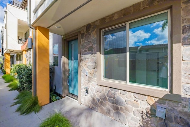 225 Scratch Rd, Covina, CA 91722 - doorway to property featuring stone siding