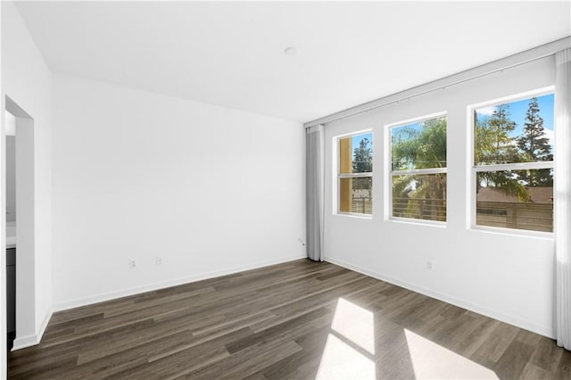 225 Scratch Rd, Covina, CA 91722 - spare room with dark wood-style flooring and baseboards