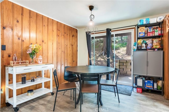 23747 Bowl Rd, Crestline, CA 92325 - dining space featuring wooden walls and wood finished floors